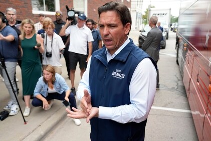 Republican presidential candidate Florida Gov. Ron DeSantis speaks to reporters following a meet and greet at the Hotel Charitone, Thursday, July 27, 2023, in Chariton, Iowa. (AP Photo/Charlie Neibergall) (AP) Republican presidential candidate Florida Gov. Ron DeSantis speaks to reporters following a meet and greet at the Hotel Charitone, Thursday, July 27, 2023, in Chariton, Iowa. (AP Photo/Charlie Neibergall) (AP)