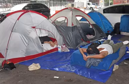 A mini tent city has appeared under the Brooklyn-Queens Expressway raising concerns about the fate of migrants booted from the city's newest mega shelters. (Gregory P. Mango) A mini tent city has appeared under the Brooklyn-Queens Expressway raising concerns about the fate of migrants booted from the city's newest mega shelters. (Gregory P. Mango)