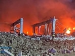 Firefighters work at a site of an administrative building damaged by a Russian missile strike, amid Russia's attack on Ukraine. (Reuters)