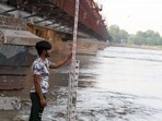 A Central Water Commission worker is checking the water level of the Yamuna river in New Delhi. (Sanjeev Verma/HT file) A Central Water Commission worker is checking the water level of the Yamuna river in New Delhi. (Sanjeev Verma/HT file)