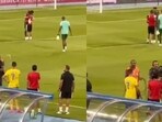 Cristiano Ronaldo throws water at a cameraperson.