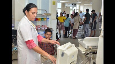 Children undergoing examination at the civil hospital in Phase 6, Mohali, on Saturday. (Ravi Kumar/HT)