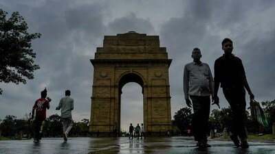 Dark clouds gather over the India Gate during monsoon season in New Delhi. (PTI) Dark clouds gather over the India Gate during monsoon season in New Delhi. (PTI)