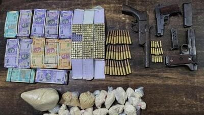 Police confiscated 1.2kg of heroin, three pistols along with 260 live cartridges of different bores and ₹1.4 lakh of drug money. (HT Photo) Police confiscated 1.2kg of heroin, three pistols along with 260 live cartridges of different bores and ₹1.4 lakh of drug money. (HT Photo)