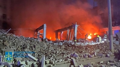 Firefighters work at a site of an administrative building damaged by a Russian missile strike, amid Russia's attack on Ukraine. (Reuters)