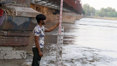 A Central Water Commission worker is checking the water level of the Yamuna river in New Delhi. (Sanjeev Verma/HT file) A Central Water Commission worker is checking the water level of the Yamuna river in New Delhi. (Sanjeev Verma/HT file)