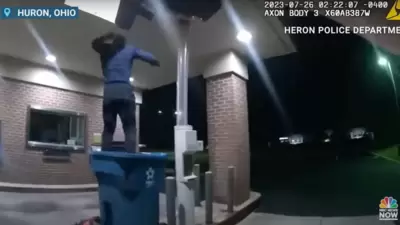 Policy body cam records failed bank robber crashing through ceiling, getting trapped in recycling bin in Huron, Ohio. (Twitter) Policy body cam records failed bank robber crashing through ceiling, getting trapped in recycling bin in Huron, Ohio. (Twitter)