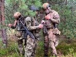 Belarusian soldier of the Special Operations Forces (SOF) and a mercenary fighter from Wagner private military company attend the weeklong maneuvers