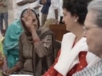 Women farmers are seen interacting with Sonia Gandhi and Priyanka Gandhi.