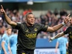PSG's Kylian Mbappe celebrates after scoring a goal. PSG's Kylian Mbappe celebrates after scoring a goal.