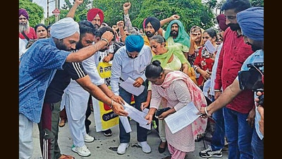 Newly regularised teachers holding a protest in Sangrur. (HT Photo)