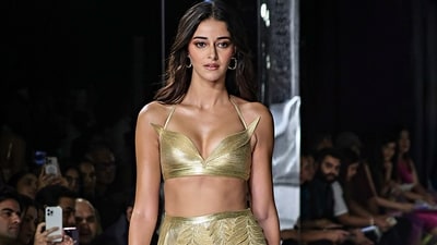 Ananya Panday's look comprises a golden slit skirt featuring 3D leaf detailing and a blouse with mesh and lace. (PTI) Ananya Panday's look comprises a golden slit skirt featuring 3D leaf detailing and a blouse with mesh and lace. (PTI)