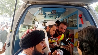 In this photo provided by Rescue 1122 Head Quarters, rescue workers carry a wounded man after a bomb explosion in the Bajur district of Khyber Pakhtunkhwa, Pakistan, Sunday, July 30. (AP) In this photo provided by Rescue 1122 Head Quarters, rescue workers carry a wounded man after a bomb explosion in the Bajur district of Khyber Pakhtunkhwa, Pakistan, Sunday, July 30. (AP)