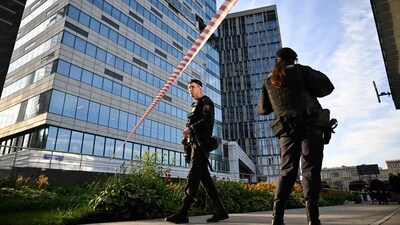 While one of the drones was shot down on the city's outskirts, two others were "suppressed by electronic warfare" and smashed into an office complex. (AFP) While one of the drones was shot down on the city's outskirts, two others were "suppressed by electronic warfare" and smashed into an office complex. (AFP)