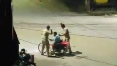 Screengrab of the video capturing two PRD jawans beating a disabled man in Deoria. Screengrab of the video capturing two PRD jawans beating a disabled man in Deoria.