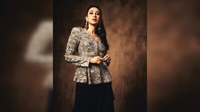 Karisma Kapoor's outfit features a grey shimmery jacket and a black skirt with asymmetrical ruffle detailing. (Instagram/@therealkarismakapoor) Karisma Kapoor's outfit features a grey shimmery jacket and a black skirt with asymmetrical ruffle detailing. (Instagram/@therealkarismakapoor)