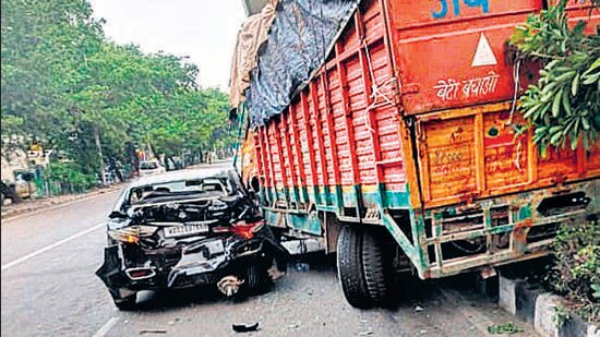 The car after being hit by the truck near Madipur Metro station in Delhi on Sunday. (HT Photo)