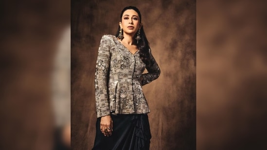 Karisma Kapoor amped up her look with black strappy stilettoes and oxidised silver jewellery.(Instagram/@therealkarismakapoor)