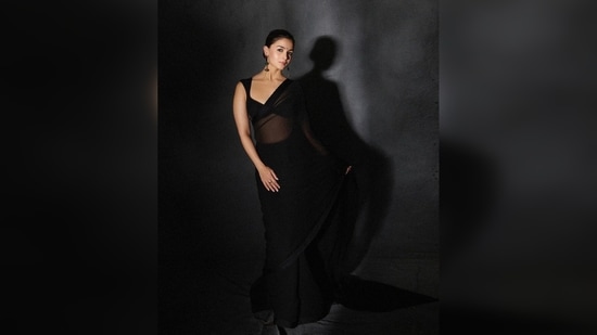 Alia Bhatt made some serious heads turn when she dropped a set of photos of herself in a chic black sheer saree.&nbsp;(Instagram/@manishmalhotra05)