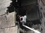 Rescuers work on a nine-storey residential building partially destroyed as a result of Russian missiles strike in Kryvyi Rig on Monday.