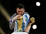 Lionel Messi with the World Cup trophy. Lionel Messi with the World Cup trophy.