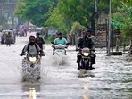 Vehicles wade through a waterlogged road after heavy monsoon rainfall, in Ajmer, Rajasthan. Vehicles wade through a waterlogged road after heavy monsoon rainfall, in Ajmer, Rajasthan.