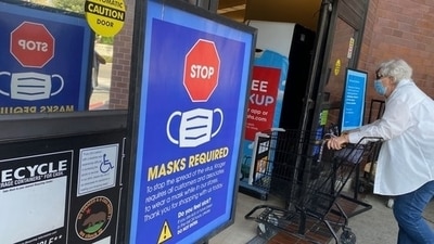 Covid In US: People shop at a grocery store enforcing the wearing of masks in Los Angeles. (AFP File) Covid In US: People shop at a grocery store enforcing the wearing of masks in Los Angeles. (AFP File)