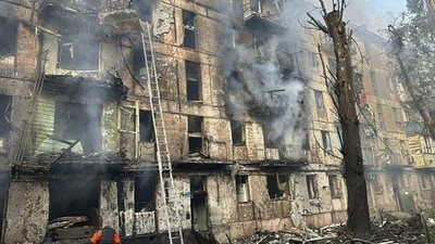 An emergency worker at a multi-storey building site after it was hit by Russian missiles in Kryvyi Rih, Ukraine.
