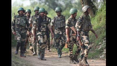 BSF personnel patrol near the International Border after foiling an infiltration attempt in Arnia sector on the outskirts of Jammu on Monday. (PTI)