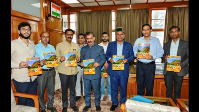 Himachal Pradesh chief minister Sukhvinder Singh Sukhu along with state horticulture minister Jagat Singh Negi and others release a book 'Vyavasayik Maun Palan' (beekeeping) published by the horticulture department on Monday. (ANI)