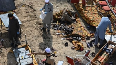 Police officials examine the site of a bomb blast in Bajaur district of Khyber-Pakhtunkhwa province. (AFP)