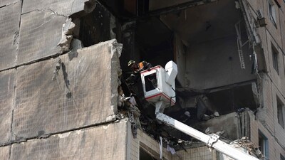 Rescuers work on a nine-storey residential building partially destroyed as a result of Russian missiles strike in Kryvyi Rig on Monday. (AFP) Rescuers work on a nine-storey residential building partially destroyed as a result of Russian missiles strike in Kryvyi Rig on Monday. (AFP)