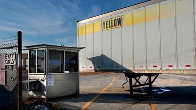 A Yellow box trailer blocks the entrance to the shuttered YRC Freight terminal in St. Louis, on Monday, July 31, 2023. Troubled trucking company Yellow Corp. is shutting down and filing for bankruptcy, the Teamsters said Monday. An official backruptcy filing is expected any day for Yellow, after years of financial struggles and growing debt. (AP) A Yellow box trailer blocks the entrance to the shuttered YRC Freight terminal in St. Louis, on Monday, July 31, 2023. Troubled trucking company Yellow Corp. is shutting down and filing for bankruptcy, the Teamsters said Monday. An official backruptcy filing is expected any day for Yellow, after years of financial struggles and growing debt. (AP)