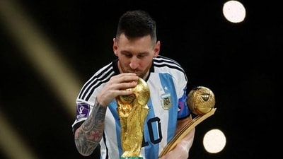Lionel Messi with the World Cup trophy. Lionel Messi with the World Cup trophy.