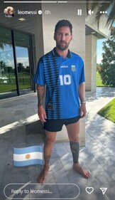 Lionel Messi poses with Diego Maradona's 1994 World Cup jersey. Lionel Messi poses with Diego Maradona's 1994 World Cup jersey.