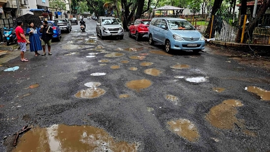 Potholes Seen on Manjrekar Road Near Apna Bazar at Andheri West, in Mumbai, India. (Photo by Vijay Bate/HT Photo) Potholes Seen on Manjrekar Road Near Apna Bazar at Andheri West, in Mumbai, India. (Photo by Vijay Bate/HT Photo)