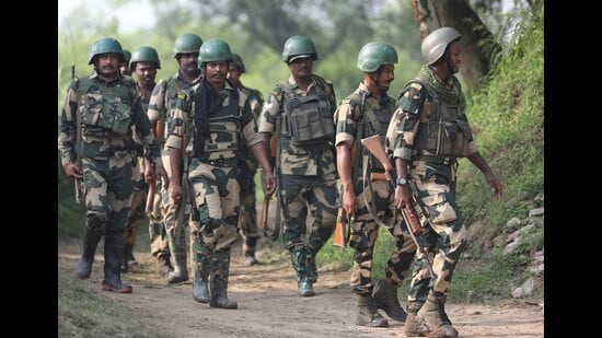 BSF personnel patrol near the International Border after foiling an infiltration attempt in Arnia sector on the outskirts of Jammu on Monday. (PTI)