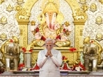 Prime Minister Narendra Modi offers prayers during a visit to Shreemant Dagdusheth Halwai Ganpati Mandir, in Pune,