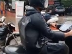 Man on an electric bike with an unusual horn.