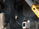 Rescuers work on a nine-storey residential building partially destroyed. Rescuers work on a nine-storey residential building partially destroyed.