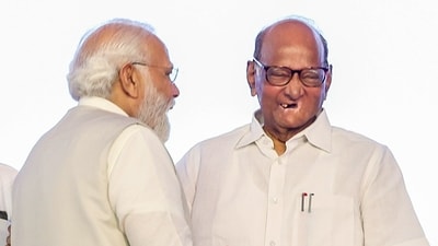 Prime Minister Narendra Modi in a candid conversation with NCP chief Sharad Pawar during the Lokmanya Tilak National Award Ceremony, in Pune on Tuesday. 