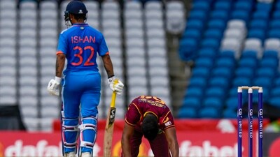 Gudakesh Motie kneels after Ishan Kishan hit a four during the third ODI (AP) Gudakesh Motie kneels after Ishan Kishan hit a four during the third ODI (AP)
