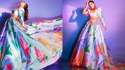 Coming to Bhumi's outfit, the blouse features a multi-coloured floral pattern on a light blue base, a wide square neckline, a cropped hem, puffed shoulders, full-length sleeves, and a fitted bust. She matched it with a skirt featuring a similar floral print, a high-rise waist, a cascading train on the back, a pleated billowy design, and a layered silhouette. (Instagram) Coming to Bhumi's outfit, the blouse features a multi-coloured floral pattern on a light blue base, a wide square neckline, a cropped hem, puffed shoulders, full-length sleeves, and a fitted bust. She matched it with a skirt featuring a similar floral print, a high-rise waist, a cascading train on the back, a pleated billowy design, and a layered silhouette. (Instagram)
