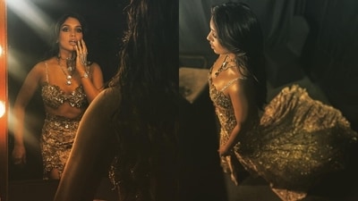 Lastly, Bhumi wore the ensemble with high heels, a choker necklace, layered chains, ornate haath phool, and statement rings. A centre-parted open wavy hairdo, bold kohl-lined eyes, smoky eye shadow, mascara on the lashes, feathered brows, glossy nude lip shade, blushed cheeks, contoured face, and beaming highlighter gave the finishing touch. (Instagram) Lastly, Bhumi wore the ensemble with high heels, a choker necklace, layered chains, ornate haath phool, and statement rings. A centre-parted open wavy hairdo, bold kohl-lined eyes, smoky eye shadow, mascara on the lashes, feathered brows, glossy nude lip shade, blushed cheeks, contoured face, and beaming highlighter gave the finishing touch. (Instagram)