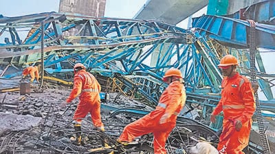 NDRF personnel during a rescue and search operation after a crane collapsed in Thane district of Maharashtra on Tuesday. (PTI) NDRF personnel during a rescue and search operation after a crane collapsed in Thane district of Maharashtra on Tuesday. (PTI)