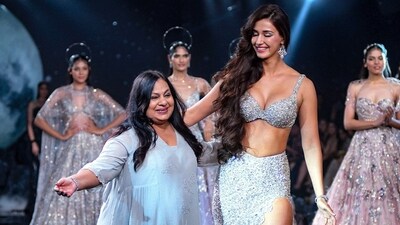 With shimmery eyeshadow, mascara-coated lashes, contoured cheeks, peach lipstick, and her hair left open in a side partition, Disha finished off her glam look. The addition of silver statement earrings further elevated her appearance. (PTI photo ) With shimmery eyeshadow, mascara-coated lashes, contoured cheeks, peach lipstick, and her hair left open in a side partition, Disha finished off her glam look. The addition of silver statement earrings further elevated her appearance. (PTI photo )