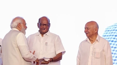 Prime Minister Narendra Modi and NCP leader Sharad Pawar were all smiles as Congress leader Sushilkumar Shinde looks on at the Lokmanya Tilak National Award ceremony in Pune on Tuesday. (HT PHOTO) Prime Minister Narendra Modi and NCP leader Sharad Pawar were all smiles as Congress leader Sushilkumar Shinde looks on at the Lokmanya Tilak National Award ceremony in Pune on Tuesday. (HT PHOTO)