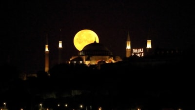Supermoon over the Ayasofya-i Kebir Camii or Hagia Sophia Grand Mosque in Istanbul, Turkey, on Tuesday. (REUTERS)