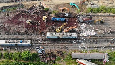 This aerial view shows damaged carriages at the accident site of a three-train collision near Balasore, 200 km from Odisha capital Bhubaneswar (AFP File Photo) This aerial view shows damaged carriages at the accident site of a three-train collision near Balasore, 200 km from Odisha capital Bhubaneswar (AFP File Photo)