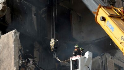 Rescuers work on a nine-storey residential building partially destroyed. (AFP) Rescuers work on a nine-storey residential building partially destroyed. (AFP)